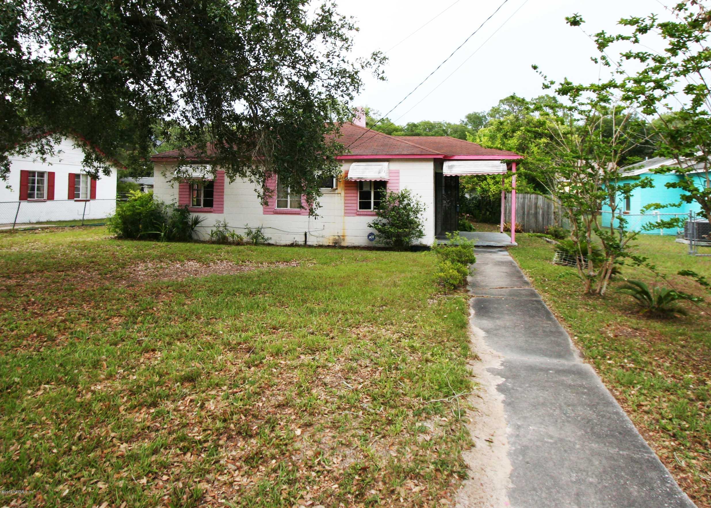 3831 Freeman Road Jacksonville, FL 32207 - Photo 1 of 11 a front view of a house with a yard and trees