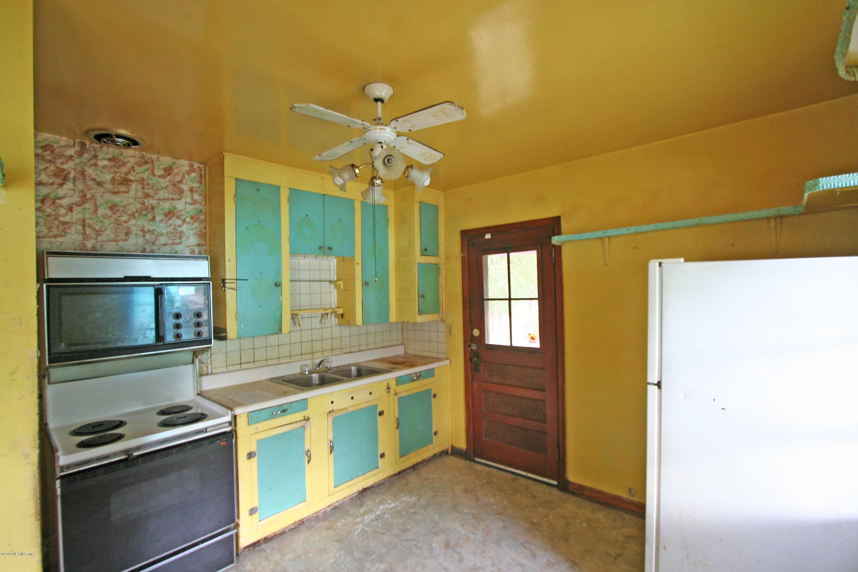 3831 Freeman Road Jacksonville, FL 32207 - Photo 3 of 11 a view of a kitchen with a sink and dishwasher a stove top oven