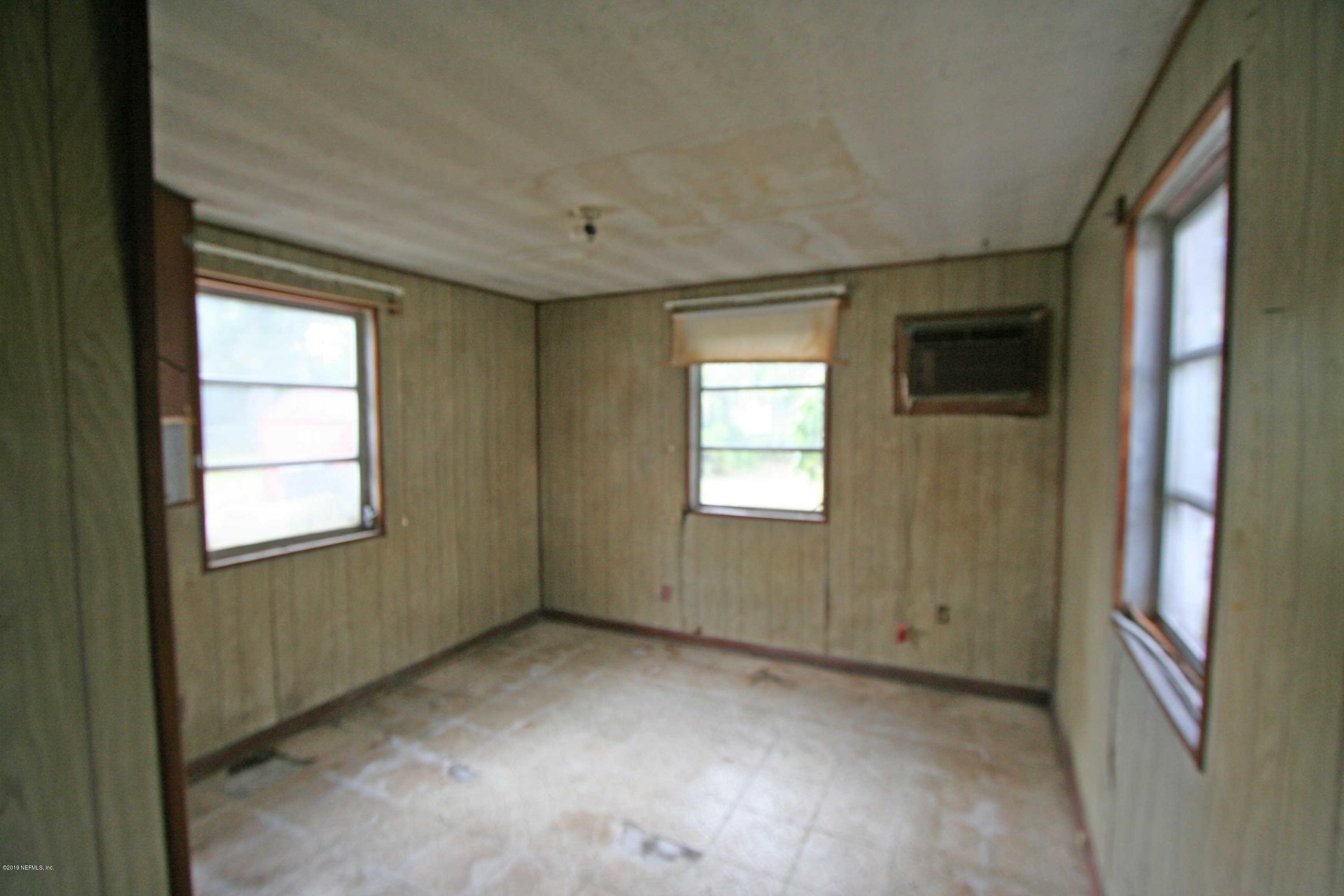 3831 Freeman Road Jacksonville, FL 32207 - Photo 4 of 11 an empty room with windows