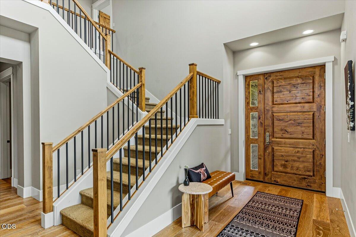 61333 Kindle Rock Loop Bend, OR 97702 - Photo 12 of 53 a view of staircase with wooden floor and a rug