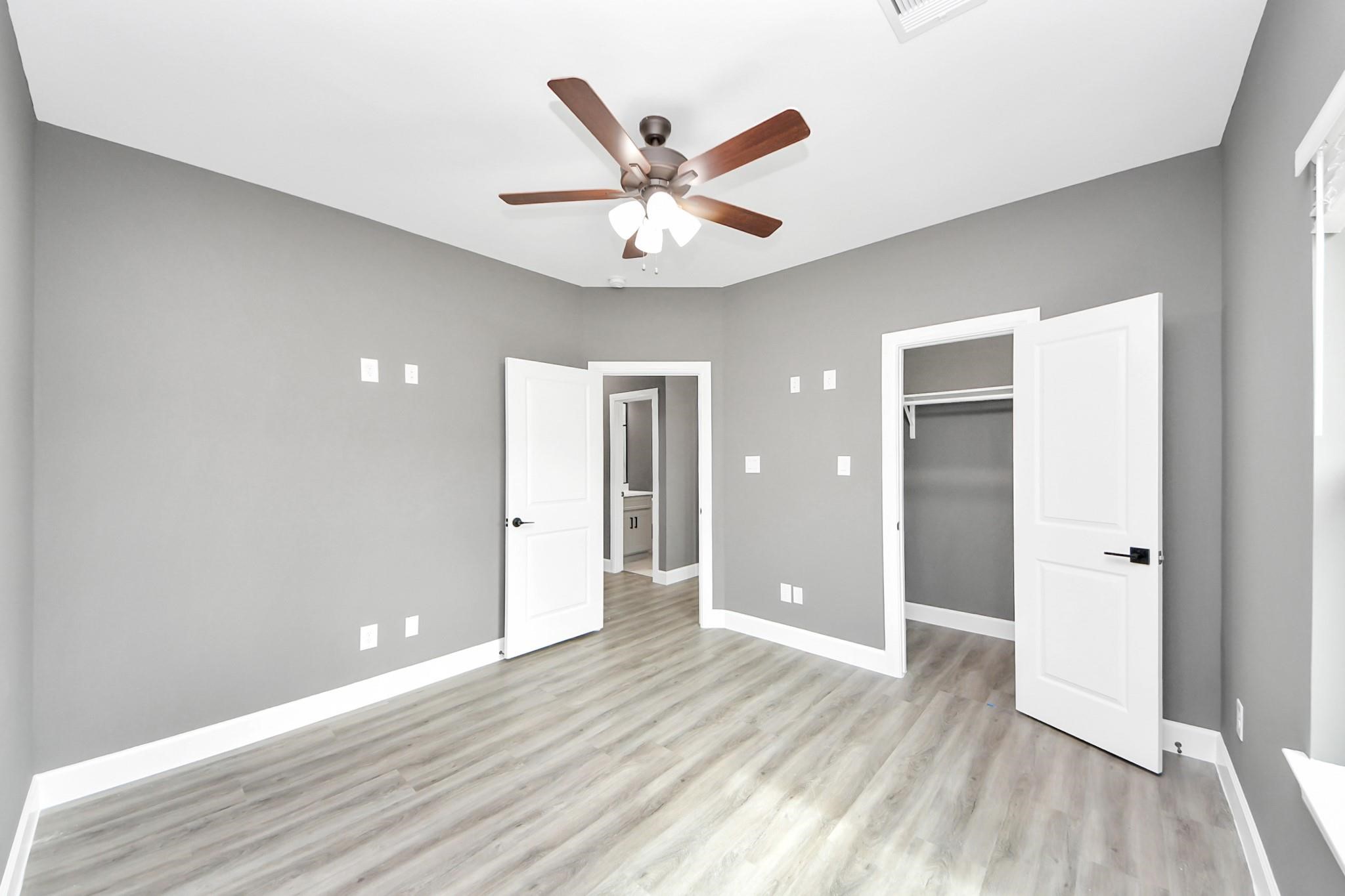 601 Lily Street Prairie View, TX 77484 - Photo 4 of 14 a view of an empty room with wooden floor