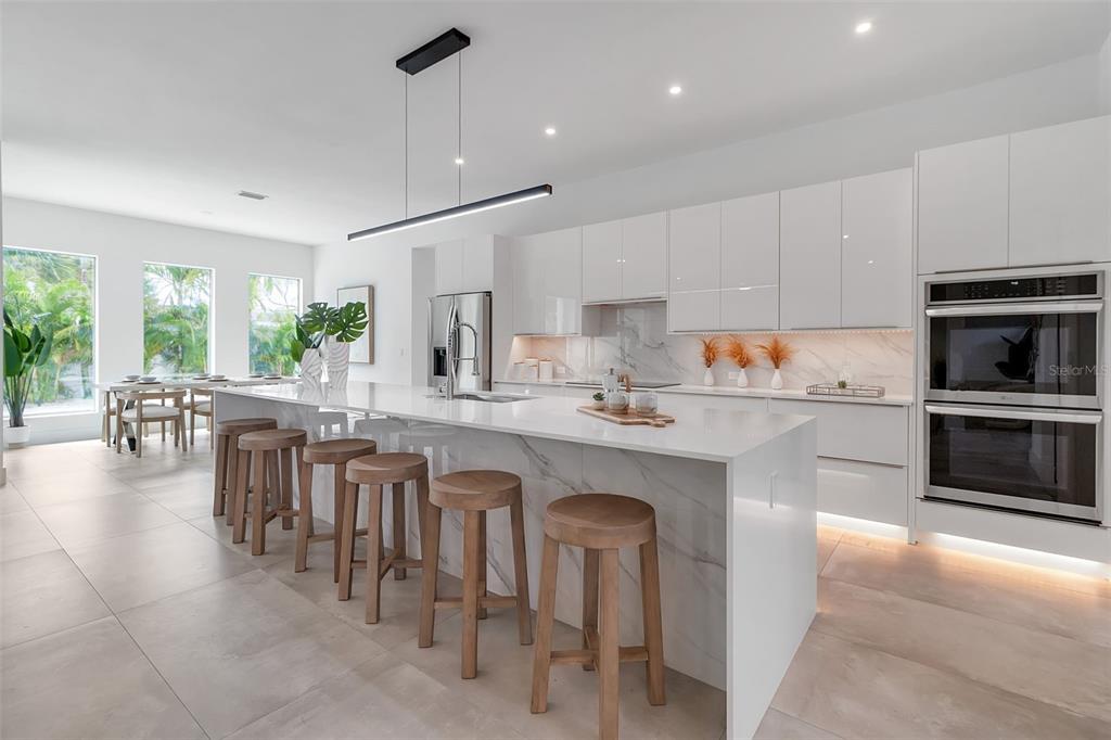 2532 Fruit Tree Drive Sarasota, FL 34239 - Photo 13 of 38 a kitchen with counter space cabinets a sink and appliances