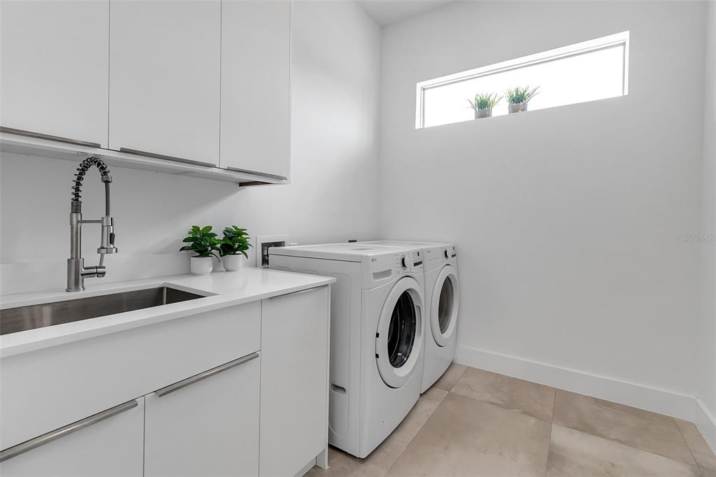 2532 Fruit Tree Drive Sarasota, FL 34239 - Photo 15 of 38 a utility room with dryer and washer
