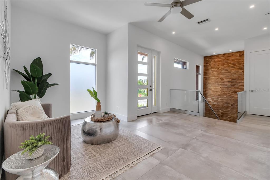 2532 Fruit Tree Drive Sarasota, FL 34239 - Photo 28 of 38 a living room with furniture and a potted plant
