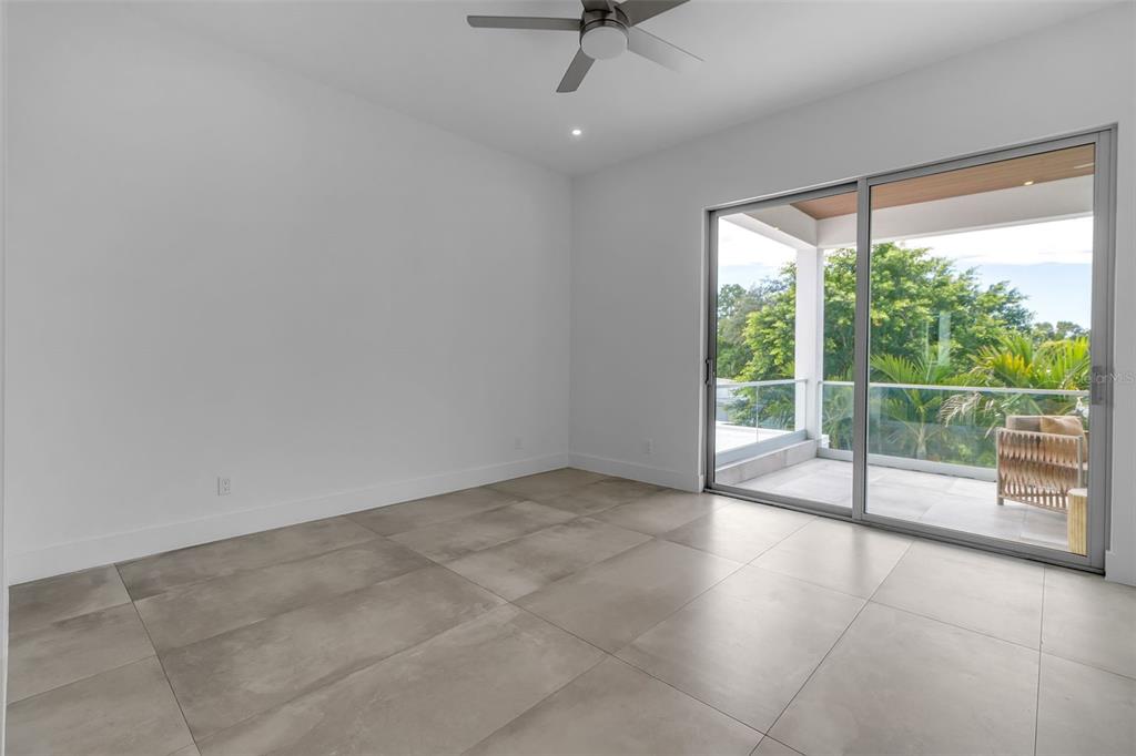 2532 Fruit Tree Drive Sarasota, FL 34239 - Photo 29 of 38 a view of an empty room with a sliding door