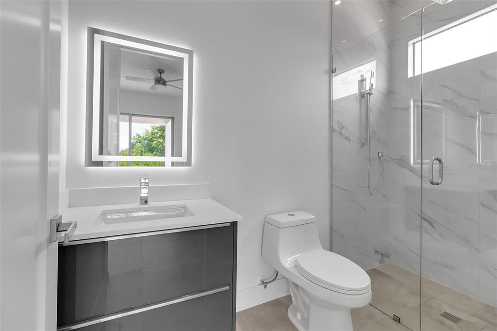 2532 Fruit Tree Drive Sarasota, FL 34239 - Photo 30 of 38 a bathroom with a sink toilet and shower