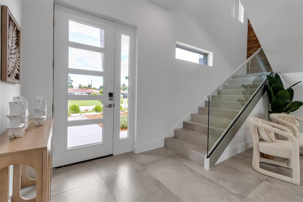 2532 Fruit Tree Drive Sarasota, FL 34239 - Photo 3 of 38 a view of an entryway with wooden floor and windows