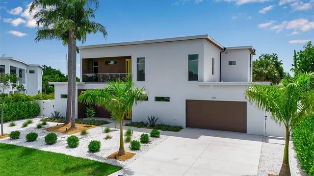 a front view of house with yard and green space