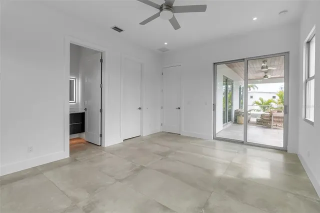 a bathroom with a toilet sink vanity and shower