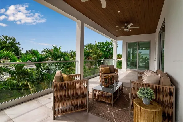 a view of a patio with chairs and a table