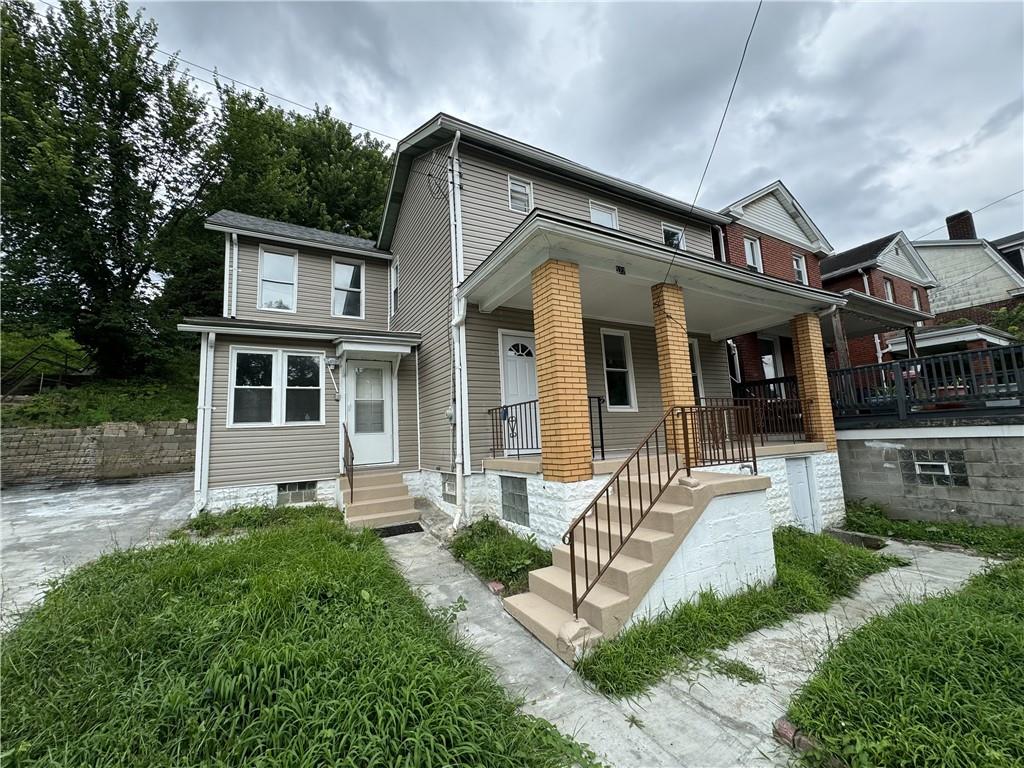 a front view of a house with a yard