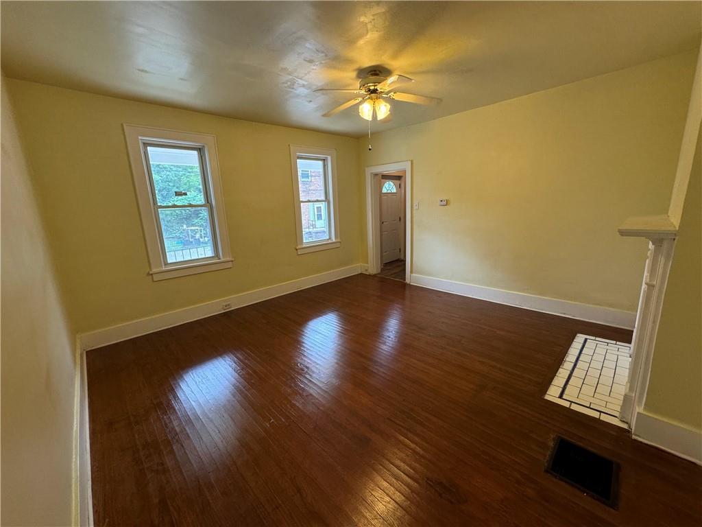 522 Cubbage Street Carnegie, PA 15106 - Photo 15 of 22 a view of an empty room with a window and wooden floor