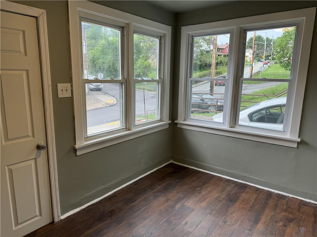 522 Cubbage Street Carnegie, PA 15106 - Photo 6 of 22 a view of an empty room with wooden floor and a window