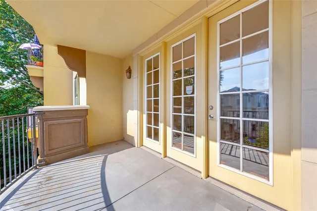 a view of an empty room with a balcony