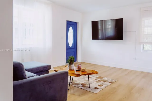 a living room with furniture and a rug
