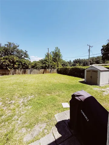 a kitchen with stainless steel appliances granite countertop a refrigerator a stove and a sink