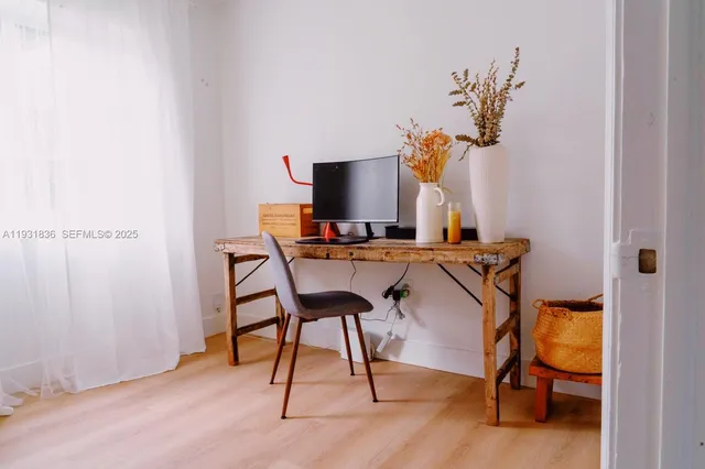 a bedroom with two beds and a window