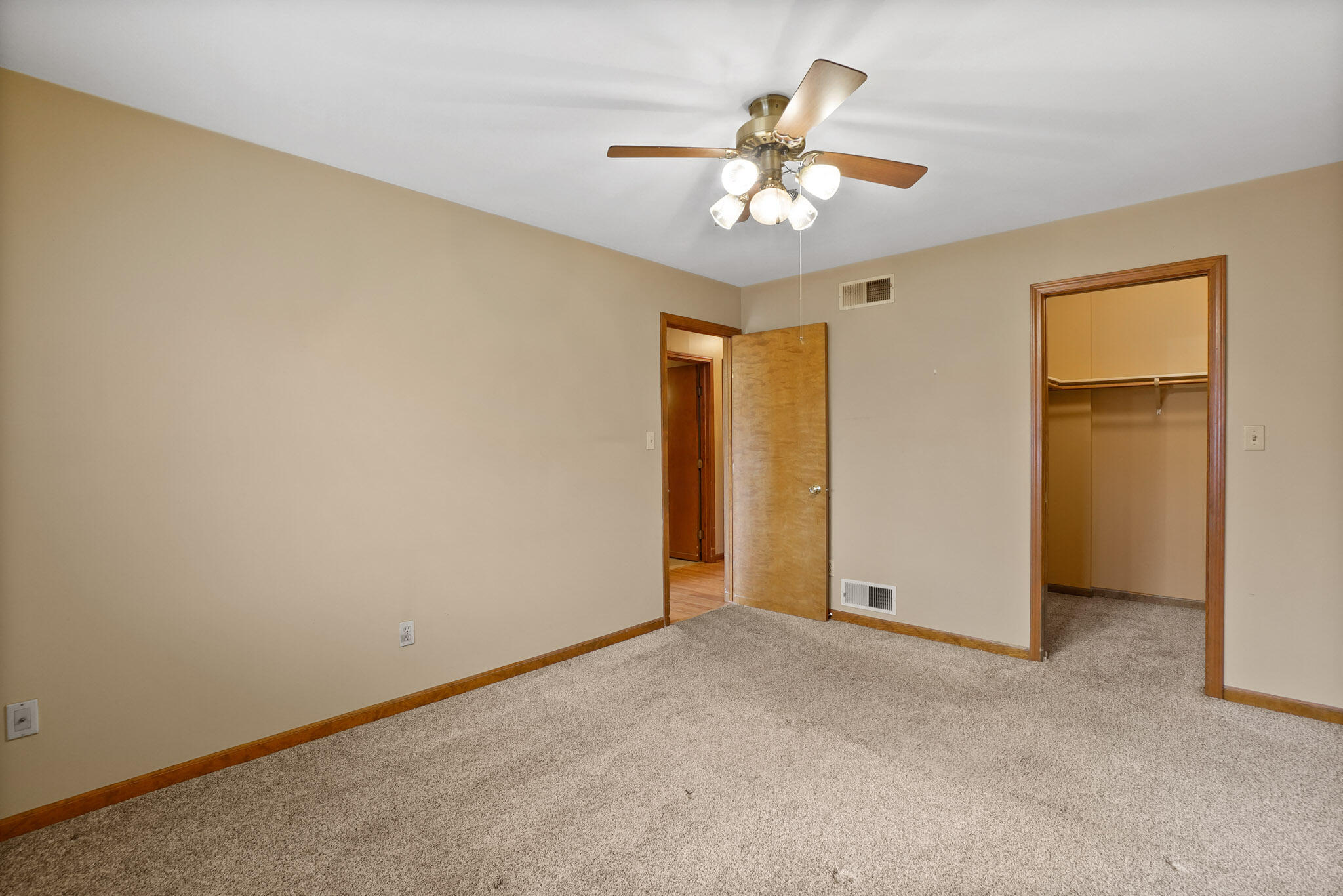 1932 Church Street Dyer, IN 46311 - Photo 11 of 20 an empty room with a chandelier fan