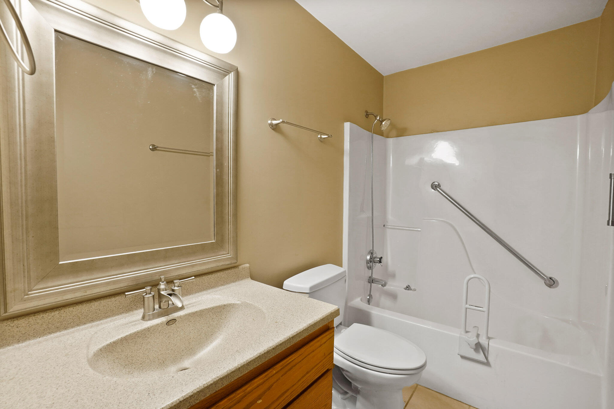 1932 Church Street Dyer, IN 46311 - Photo 16 of 20 a bathroom with a sink a toilet and shower