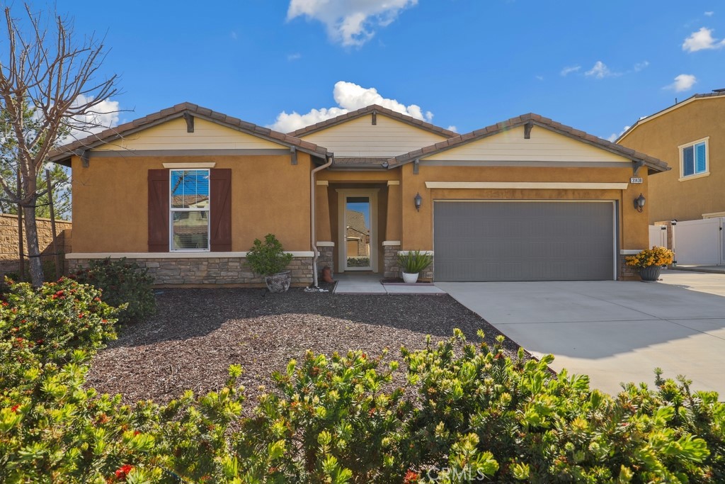31438 Caprice Road Menifee, CA 92584 - Photo 1 of 1 a front view of a house with a yard and garage