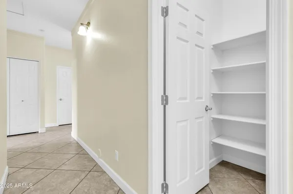 a view of a hallway with closet