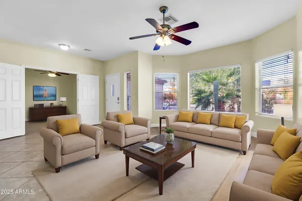 an empty room with fan and a ceiling fan