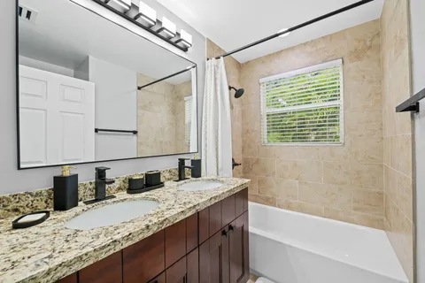 a bathroom with a toilet sink and a shower