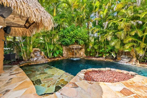a view of a backyard with plants and a patio