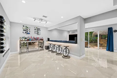 a view of a livingroom with furniture and a flat screen tv