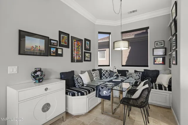 a living room with furniture and white walls