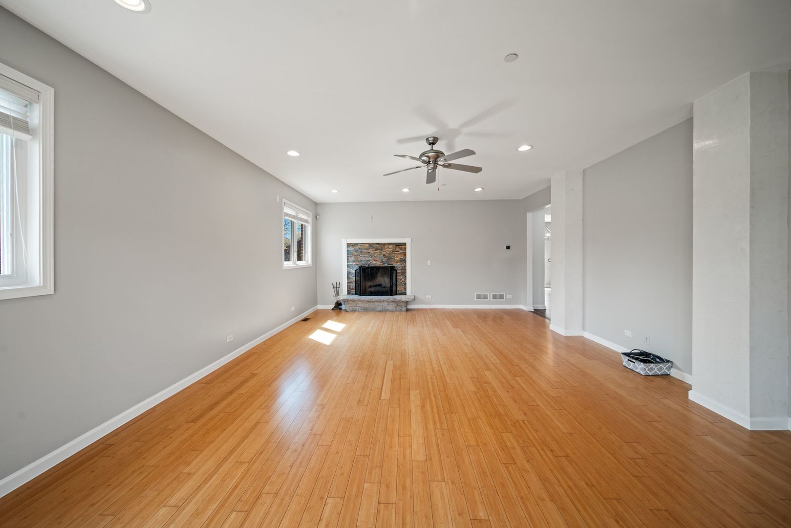 701 Oakton Street Park Ridge, IL 60068 - Photo 4 of 59 a view of empty room with wooden floor and fireplace