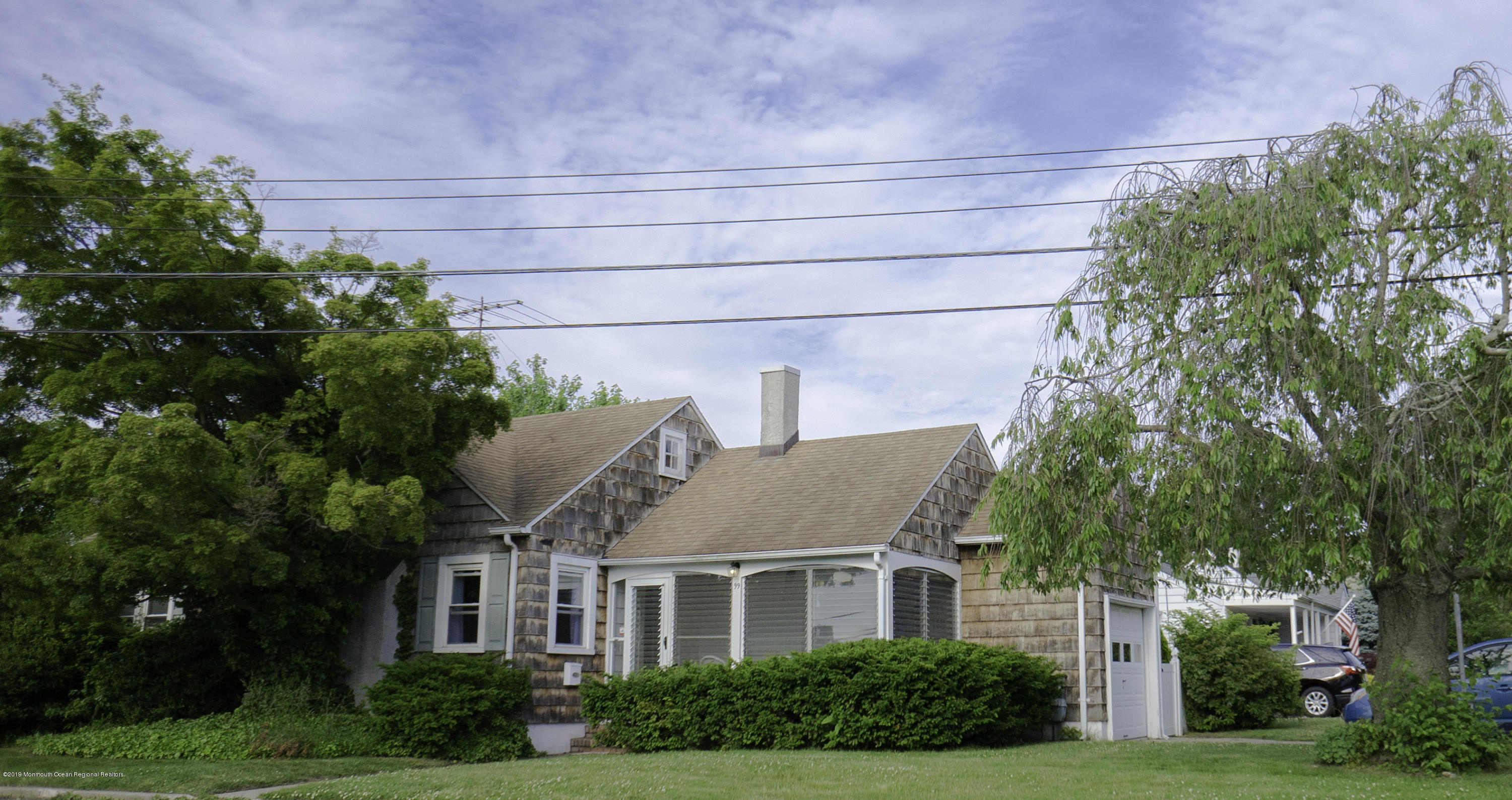 a view of house with outdoor space and garden