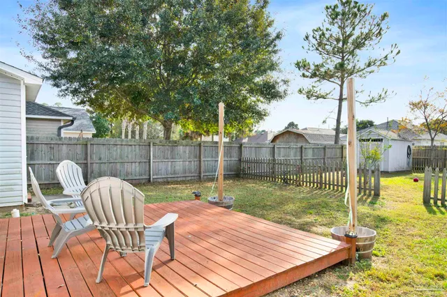 a view of a patio with a table chairs and a patio
