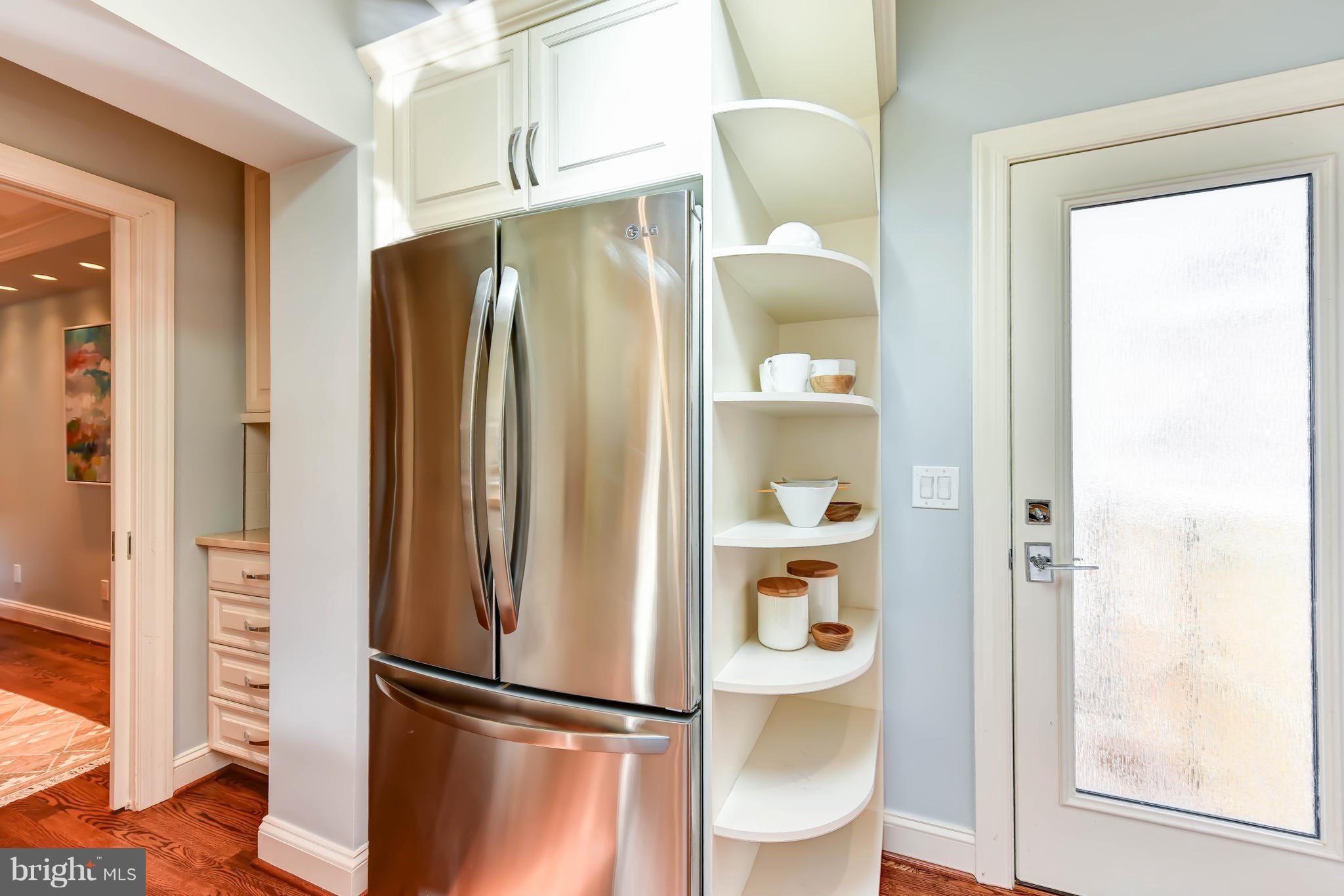 21 3rd Street Northeast Washington, DC 20002 - Photo 11 of 29 a metallic refrigerator freezer sitting in a kitchen