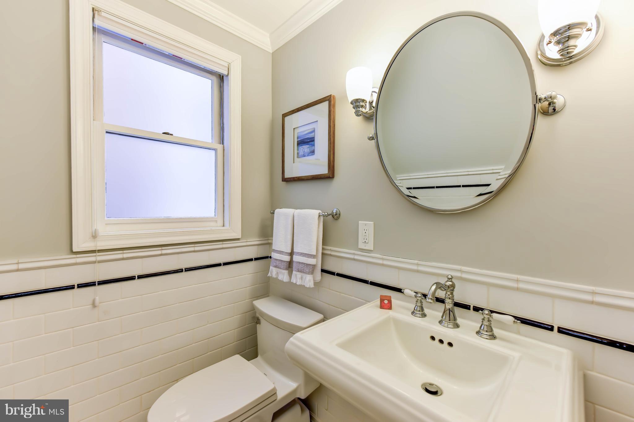 21 3rd Street Northeast Washington, DC 20002 - Photo 13 of 29 a bathroom with a toilet a sink and mirror