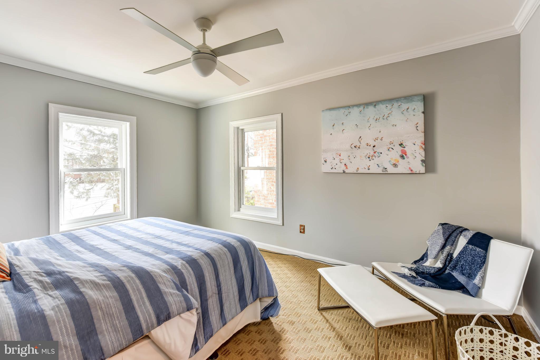 21 3rd Street Northeast Washington, DC 20002 - Photo 15 of 29 a bedroom with a bed and wooden floor