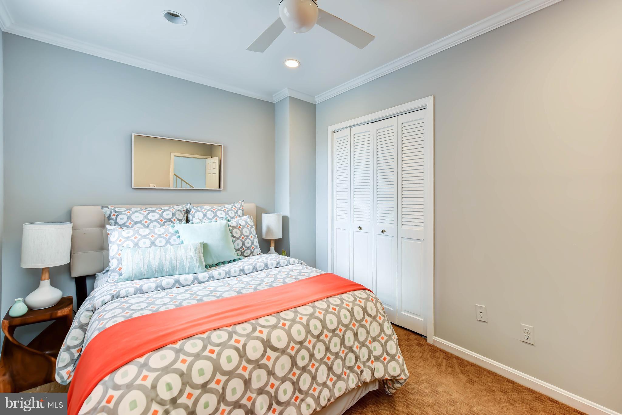21 3rd Street Northeast Washington, DC 20002 - Photo 17 of 29 a bedroom with a large bed and a painting on the wall