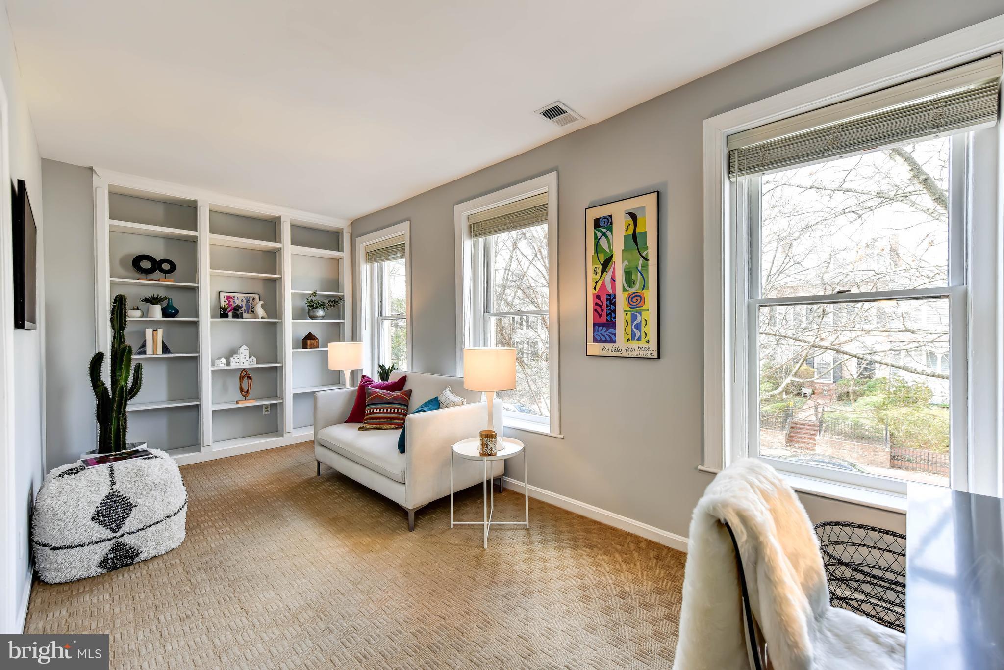 21 3rd Street Northeast Washington, DC 20002 - Photo 19 of 29 a living room with furniture and a window