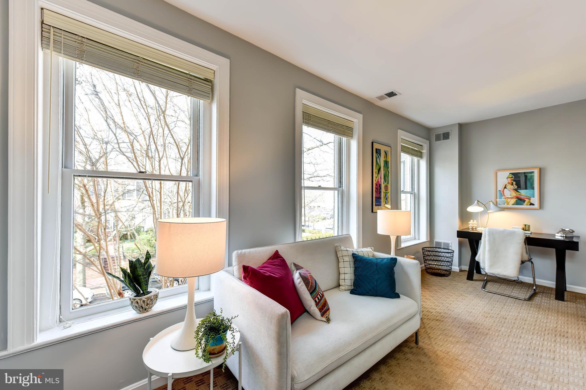 21 3rd Street Northeast Washington, DC 20002 - Photo 20 of 29 a living room with furniture and a large window