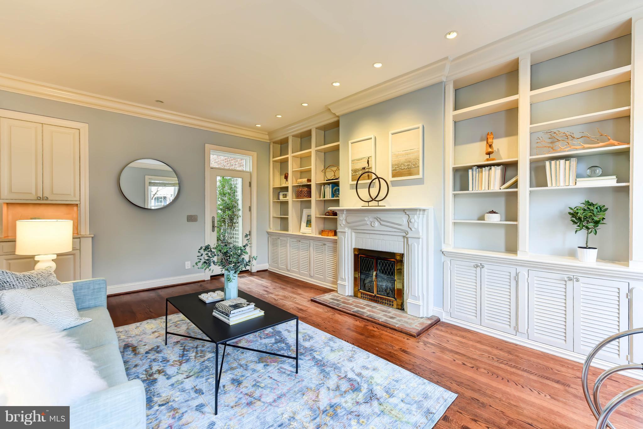 21 3rd Street Northeast Washington, DC 20002 - Photo 3 of 29 a living room with furniture fireplace and window