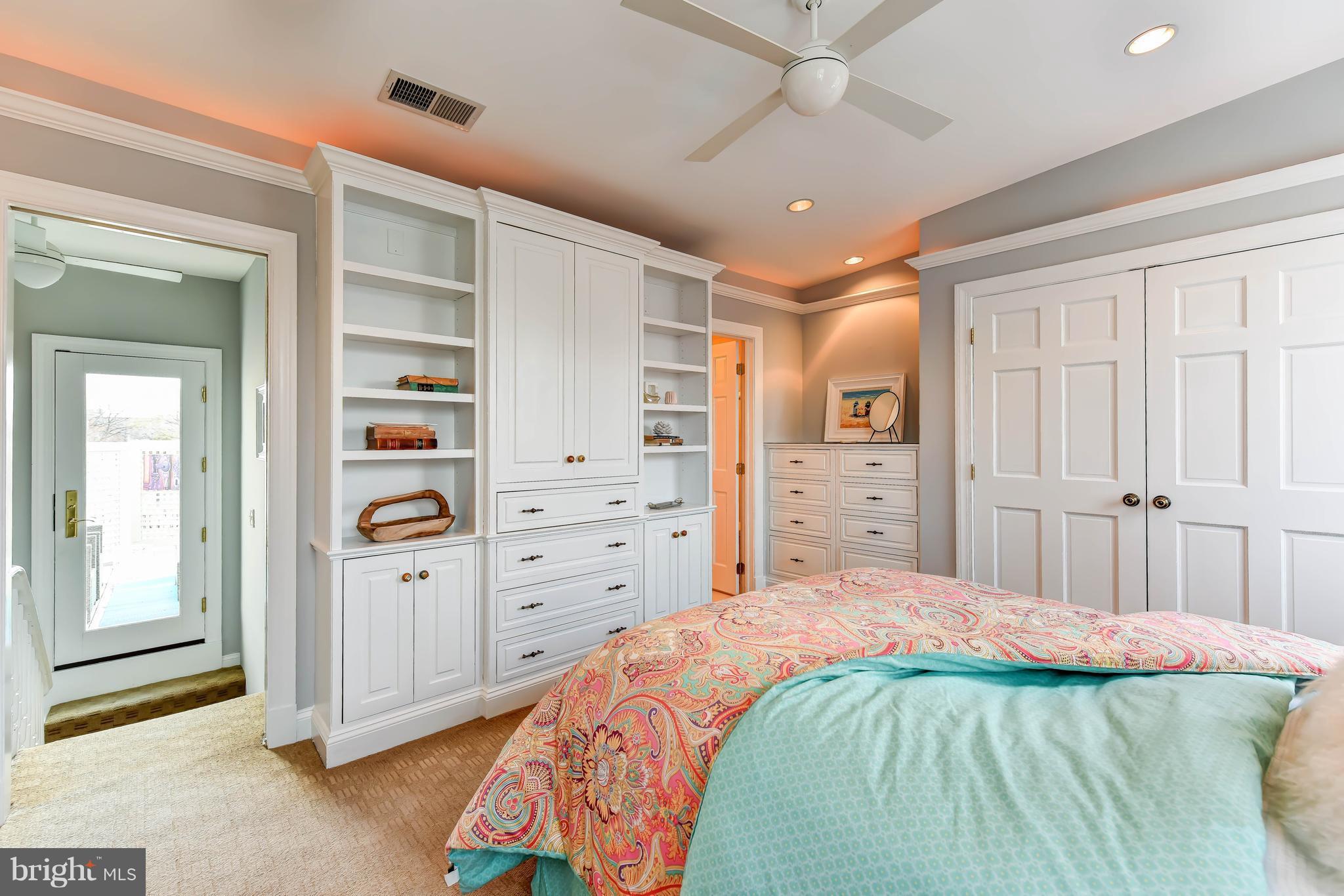 21 3rd Street Northeast Washington, DC 20002 - Photo 25 of 29 a spacious bedroom with a bed and a cabinets