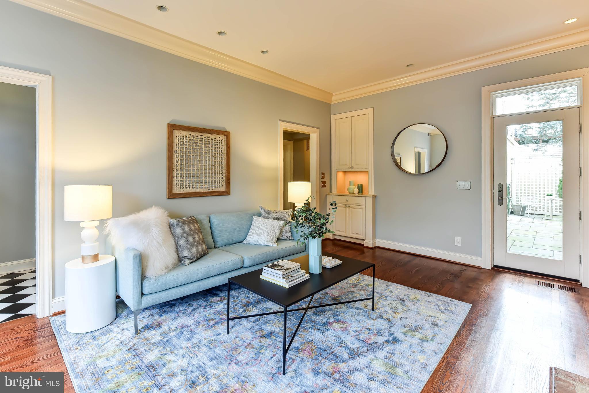 21 3rd Street Northeast Washington, DC 20002 - Photo 4 of 29 a living room with furniture and wooden floor