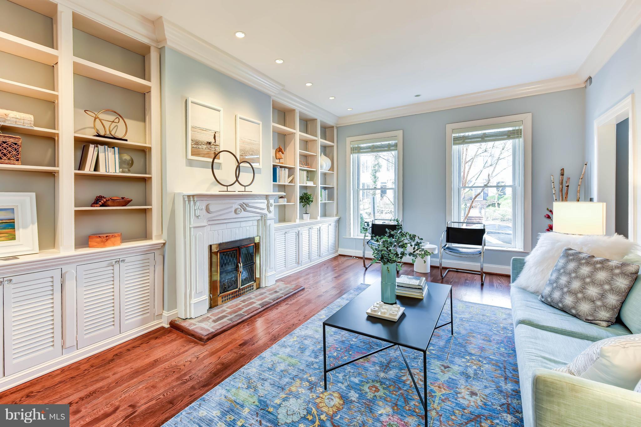 21 3rd Street Northeast Washington, DC 20002 - Photo 6 of 29 a living room with furniture fireplace and wooden floor