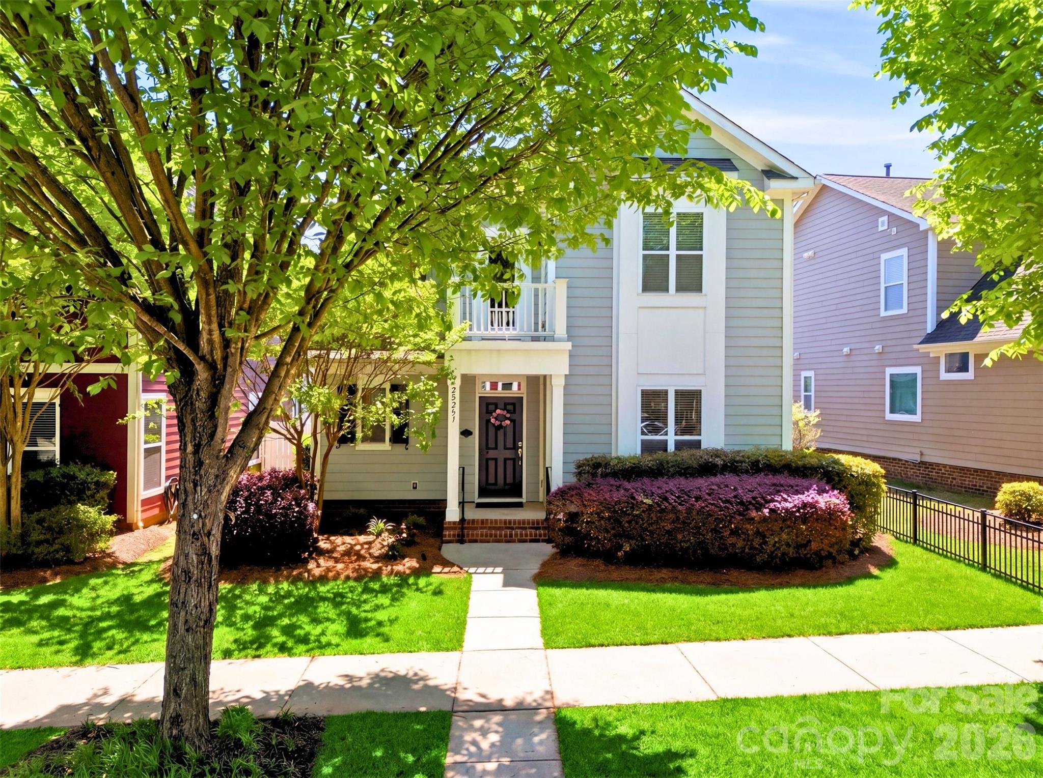 22237 Market Street Cornelius, NC 28031 - Photo 1 of 45 a front view of a house with a garden