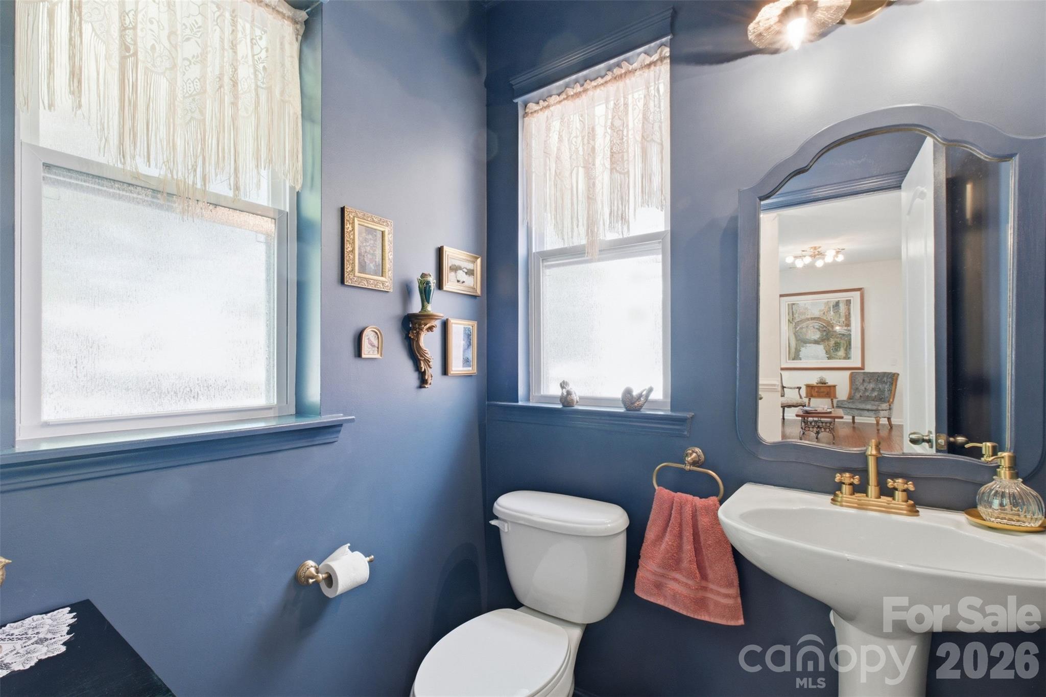 22237 Market Street Cornelius, NC 28031 - Photo 12 of 45 a bathroom with a toilet sink and mirror