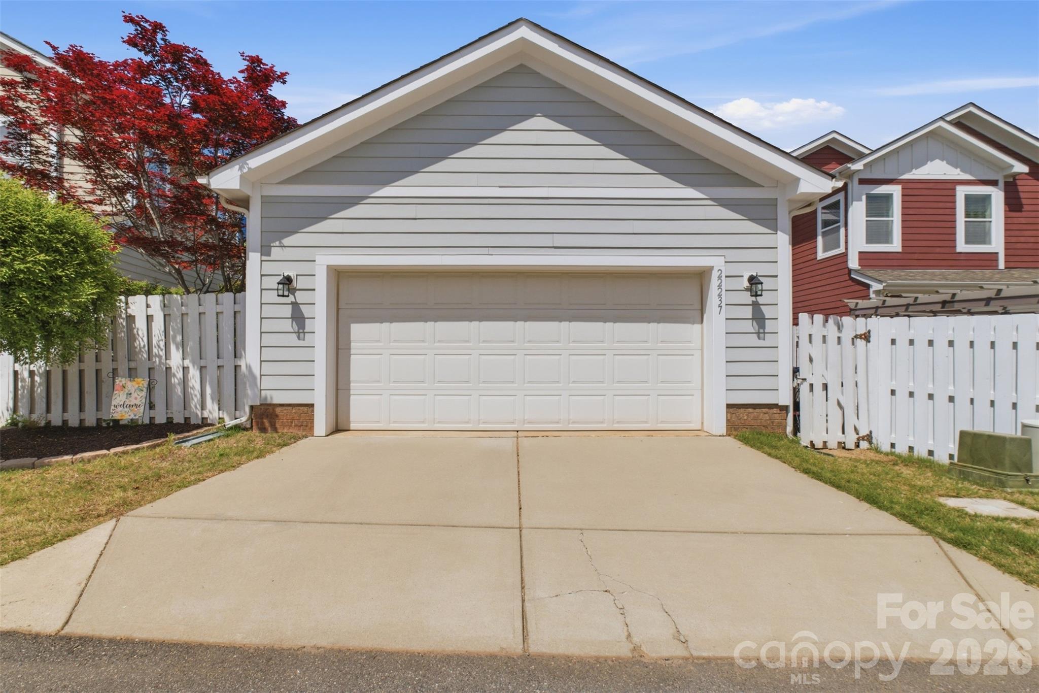 22237 Market Street Cornelius, NC 28031 - Photo 5 of 45 a front view of a house with a garage