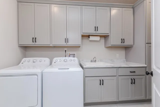 a view of storage and utility room with washer and dryer