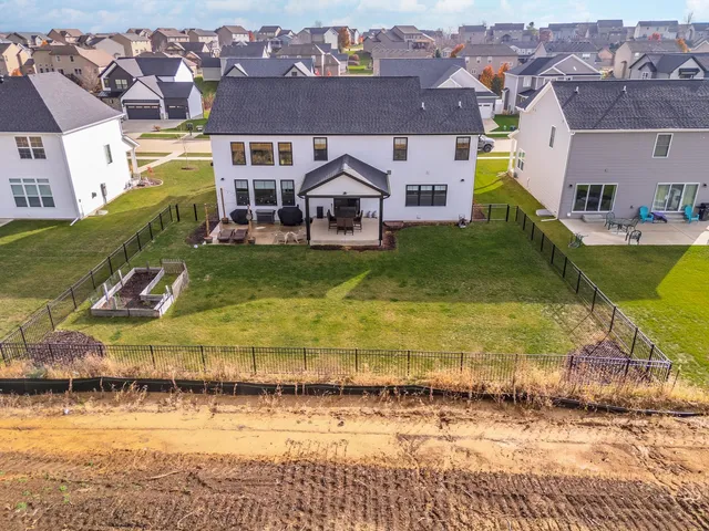 an aerial view of a house with a ocean view