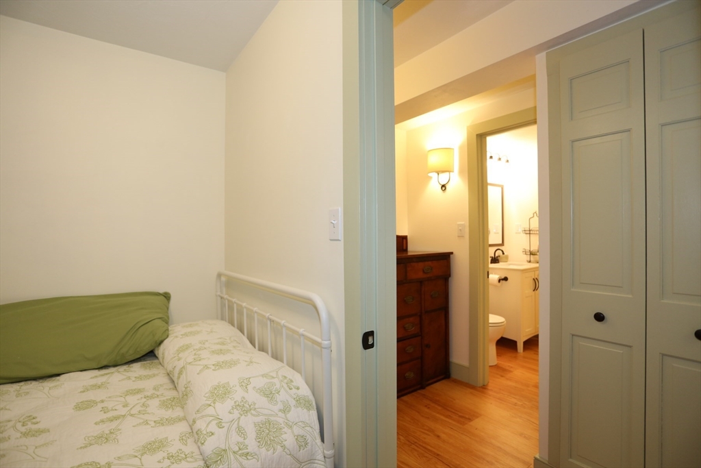 24 Pershing Road, Unit 24 Needham, MA 02494 - Photo 23 of 39 a view of bedroom and bathroom