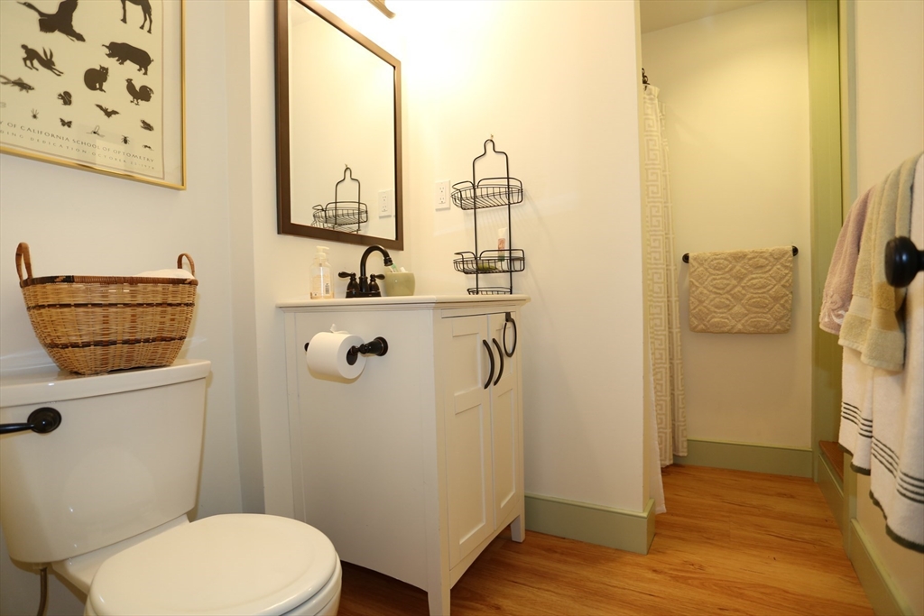 24 Pershing Road, Unit 24 Needham, MA 02494 - Photo 26 of 39 a bathroom with a toilet a sink and shower